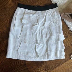 BCBG white skirt size 0. Has small stain and small pills from wear and wash.